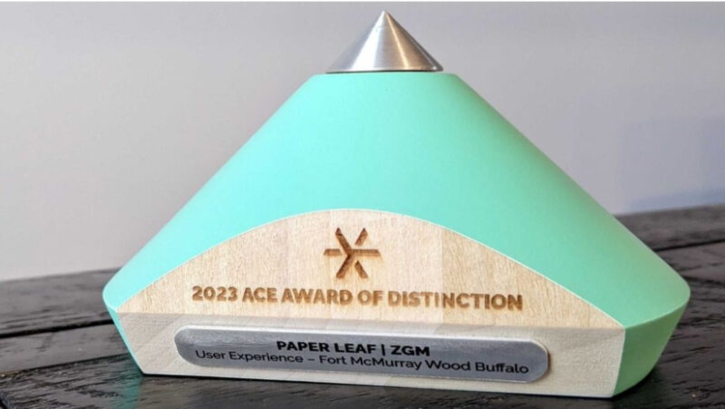 A rounded pyramid-shaped award with the words 2023 Ace Award of Distinction etched in it.